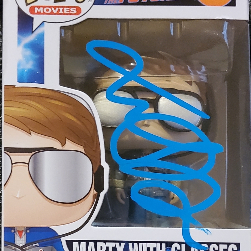 Funko Pop! Vinyl Marty with glasses signed and authentic comes with a hard case.